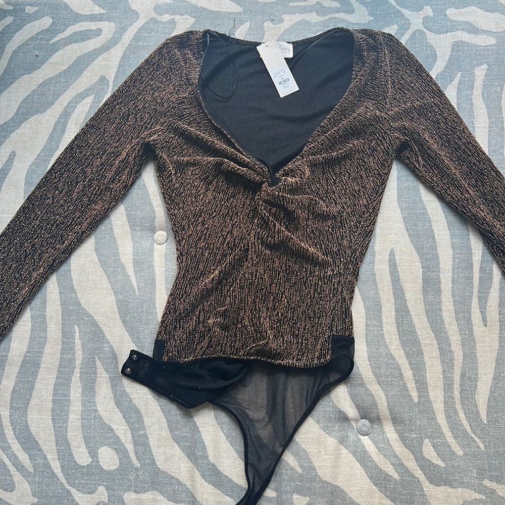Francesca’s black and gold never worn body suit with tags! Trendy, cute, modern